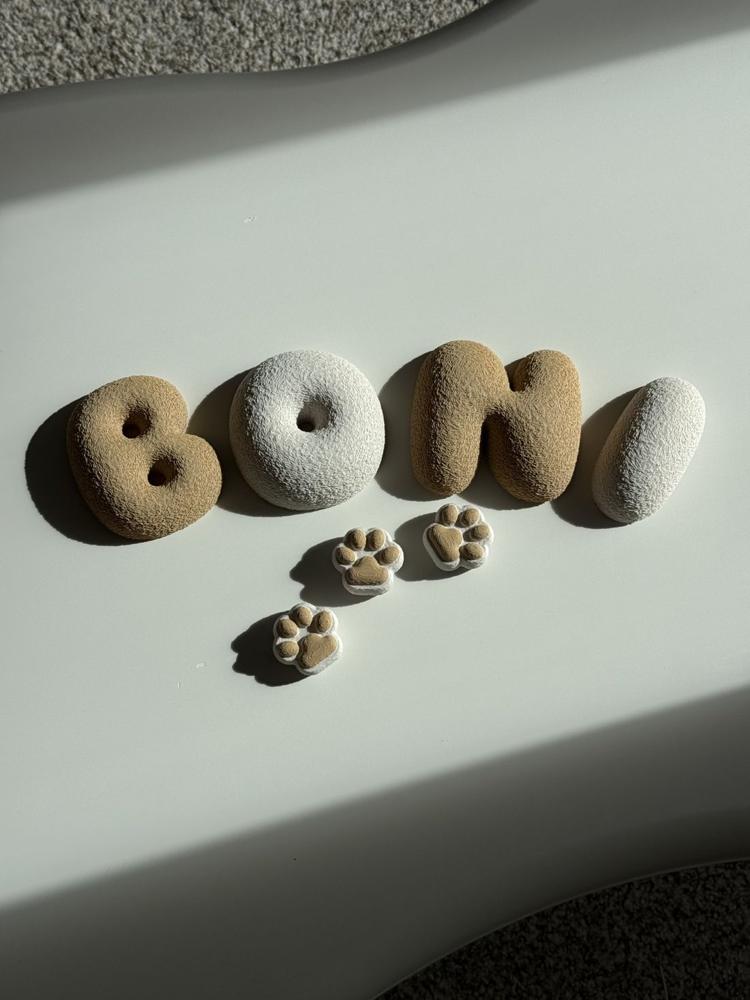 BONI letters with three small paws