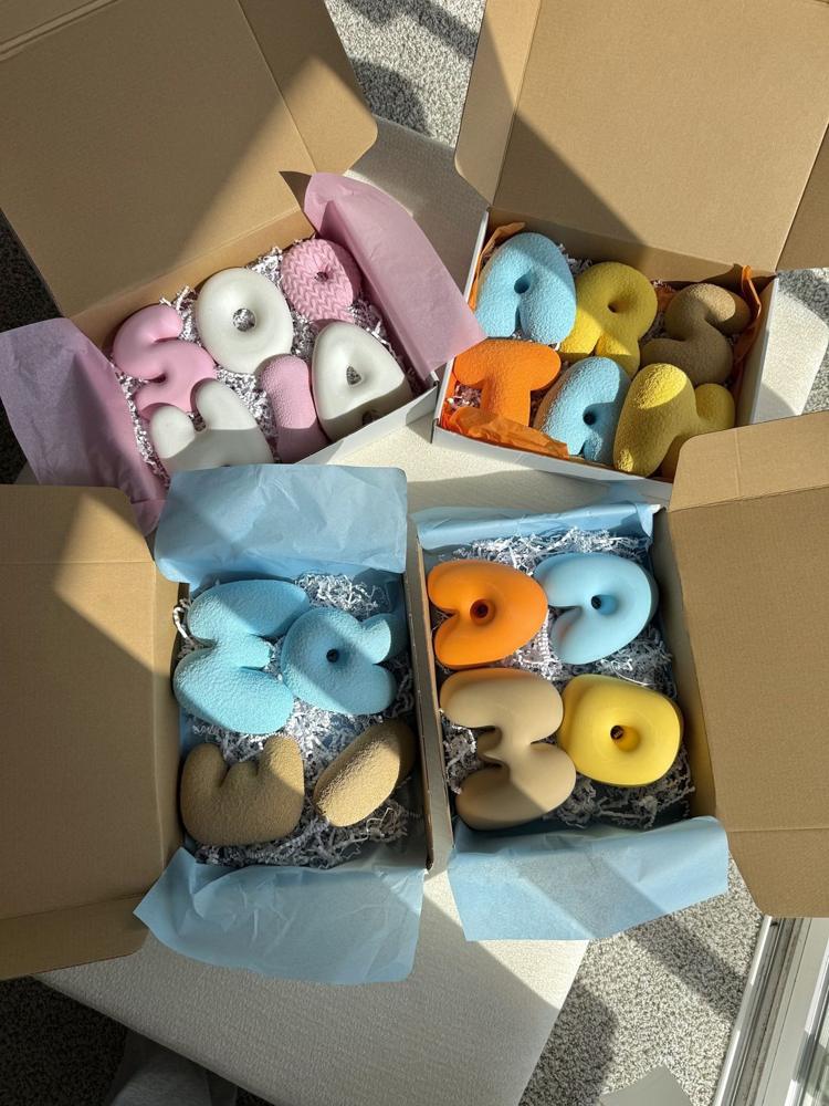 Several name sets packed with tissue paper