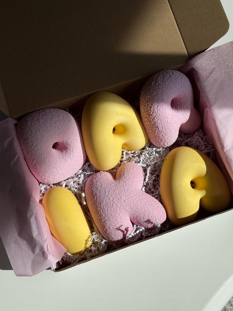 DARIKA letters packed in a box