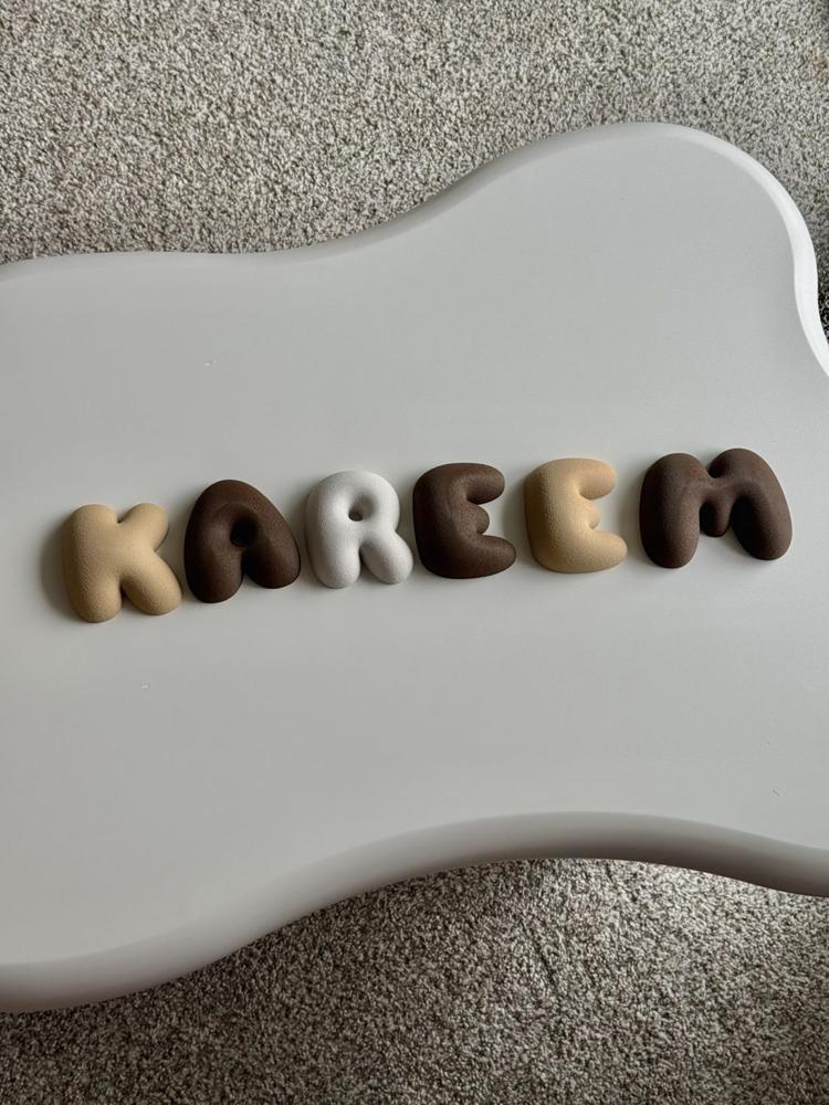 Brown and cream KAREEM letters