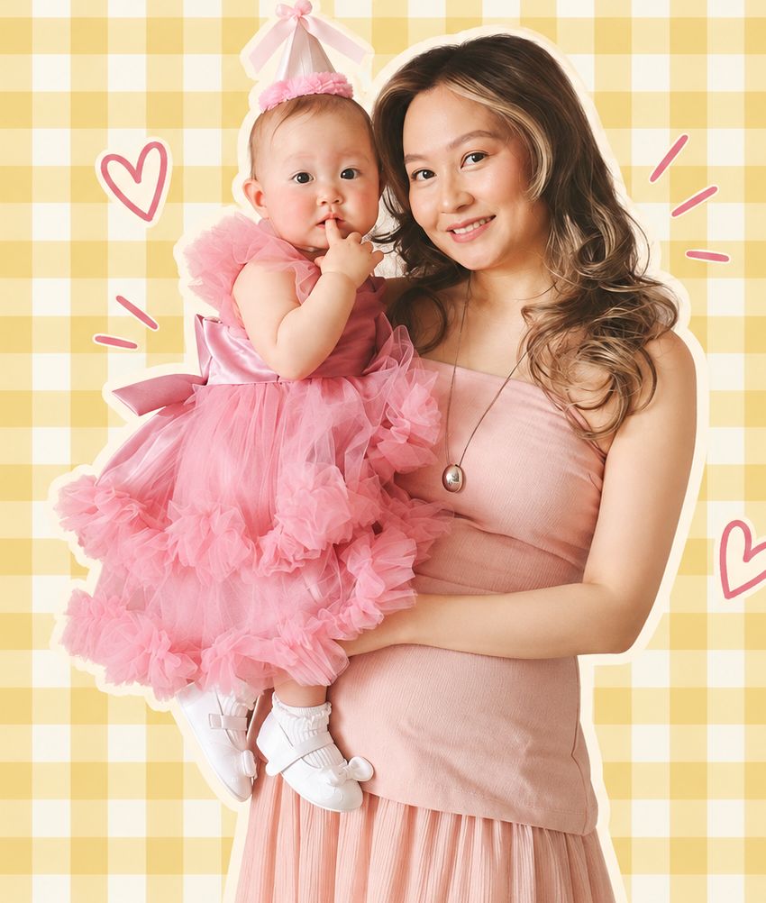 Akmaral holding her daughter Ayla in a pink tutu